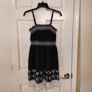 Black with white trim dress by Magic in L